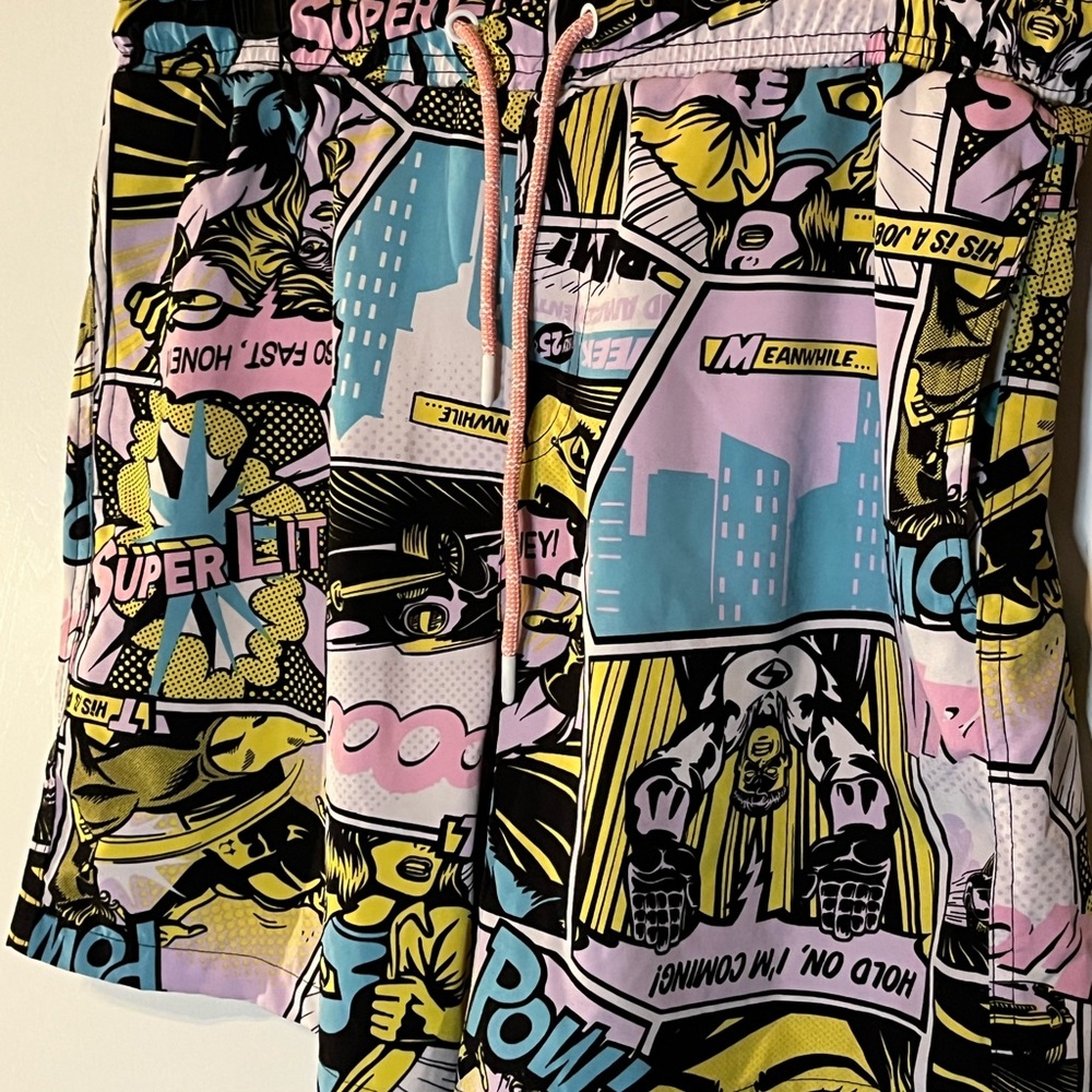 Snap Men’s Comic-Print Swim Trunks in Pink, Yellow, Blue, Black